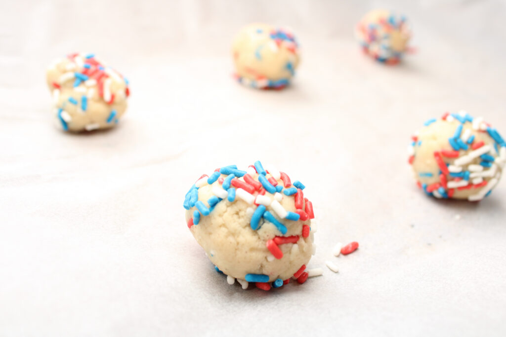 close-up of gluten-free patriotic cookies rolled in a ball