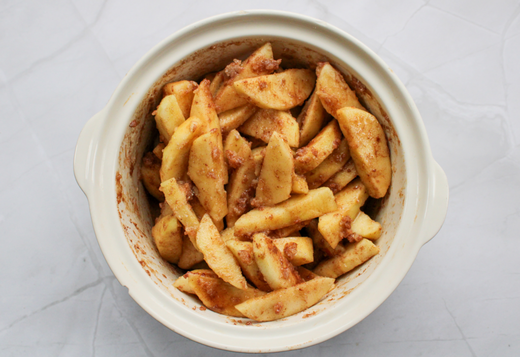 sliced apples with filling ingredients for gluten-free apple crisp