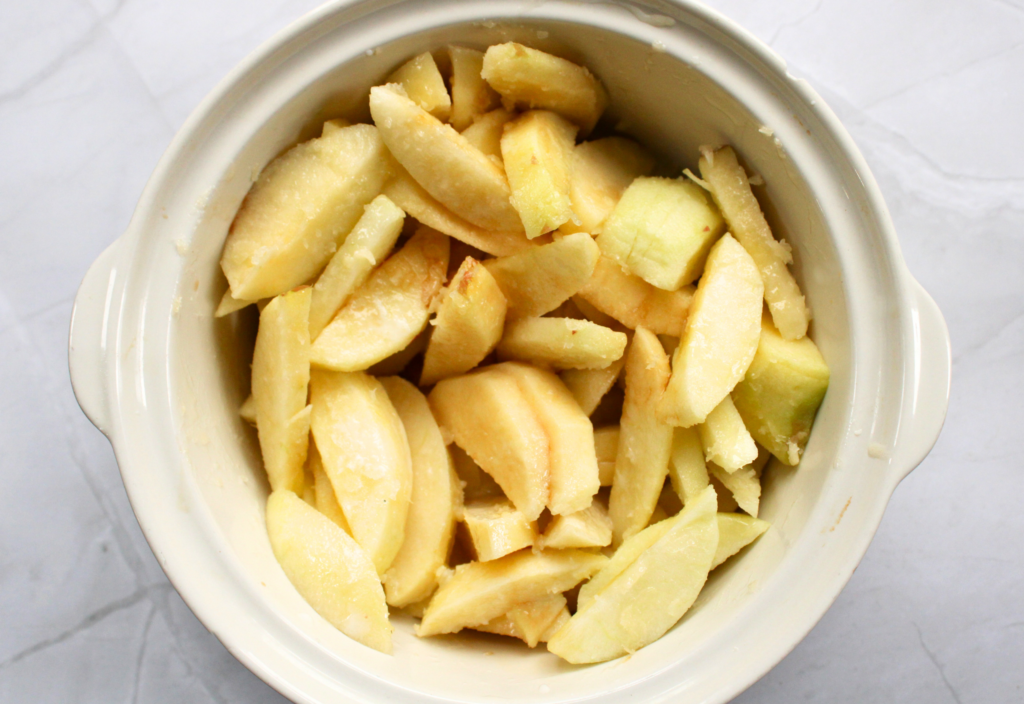 sliced apples with filling ingredients for gluten-free apple crisp